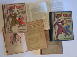  John Dough and the Cherub's first edition came with illustrated endpapers, a small design on the back cover, and an essay contest blank young readers could cut out to submit to the publisher.