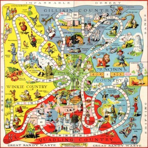 Board art depicts the map of the land of Oz separated into four quadrants, with the Emerald City at the center, populated by friends and foes from the first thirteen Oz books.